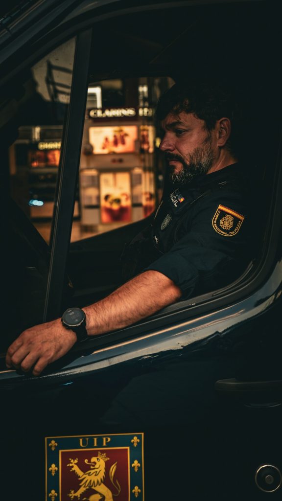 a-policeman-sits-inside-of-a-police-vehicle-hiyav5x9-hc